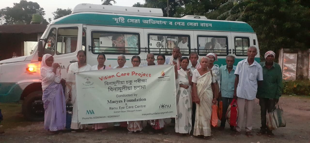Vision Care Project camp team and patients with the eye care van